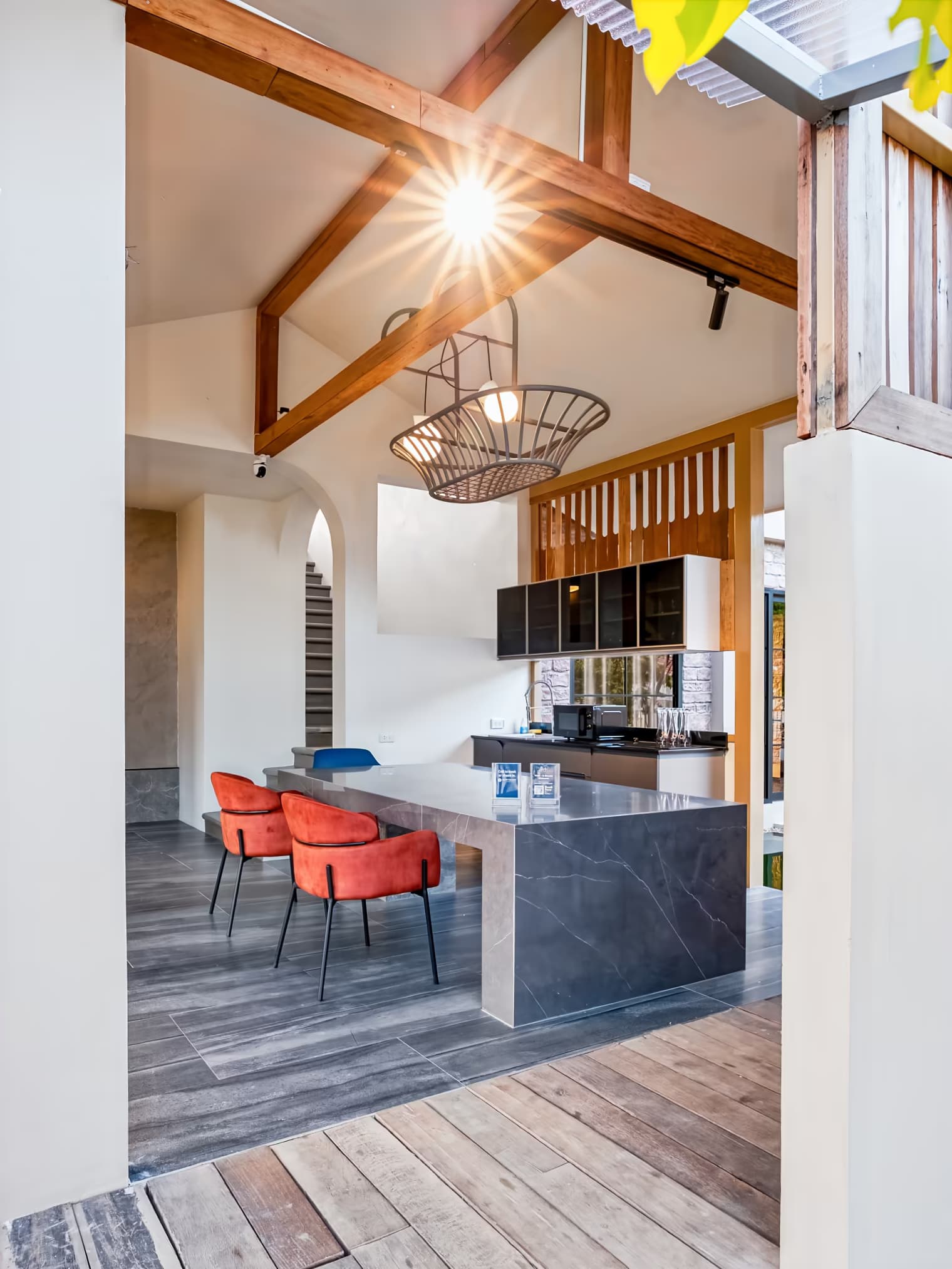 The Arch Casa design hotel Pai vaulted-ceiling common lounge with marble island and pendant lighting