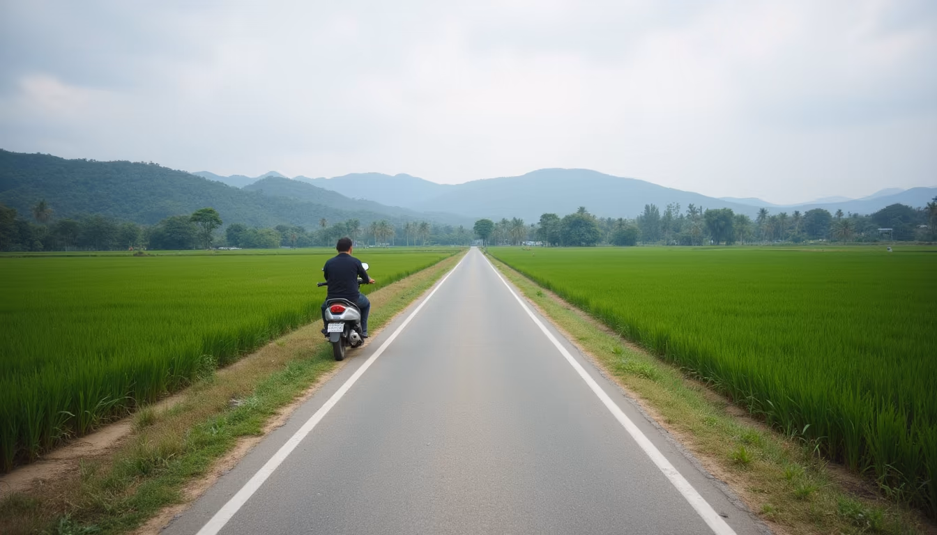 Quiet rural lane through rice fields with a parked scooter, deciding on motorbike rental in Pai (illustration)