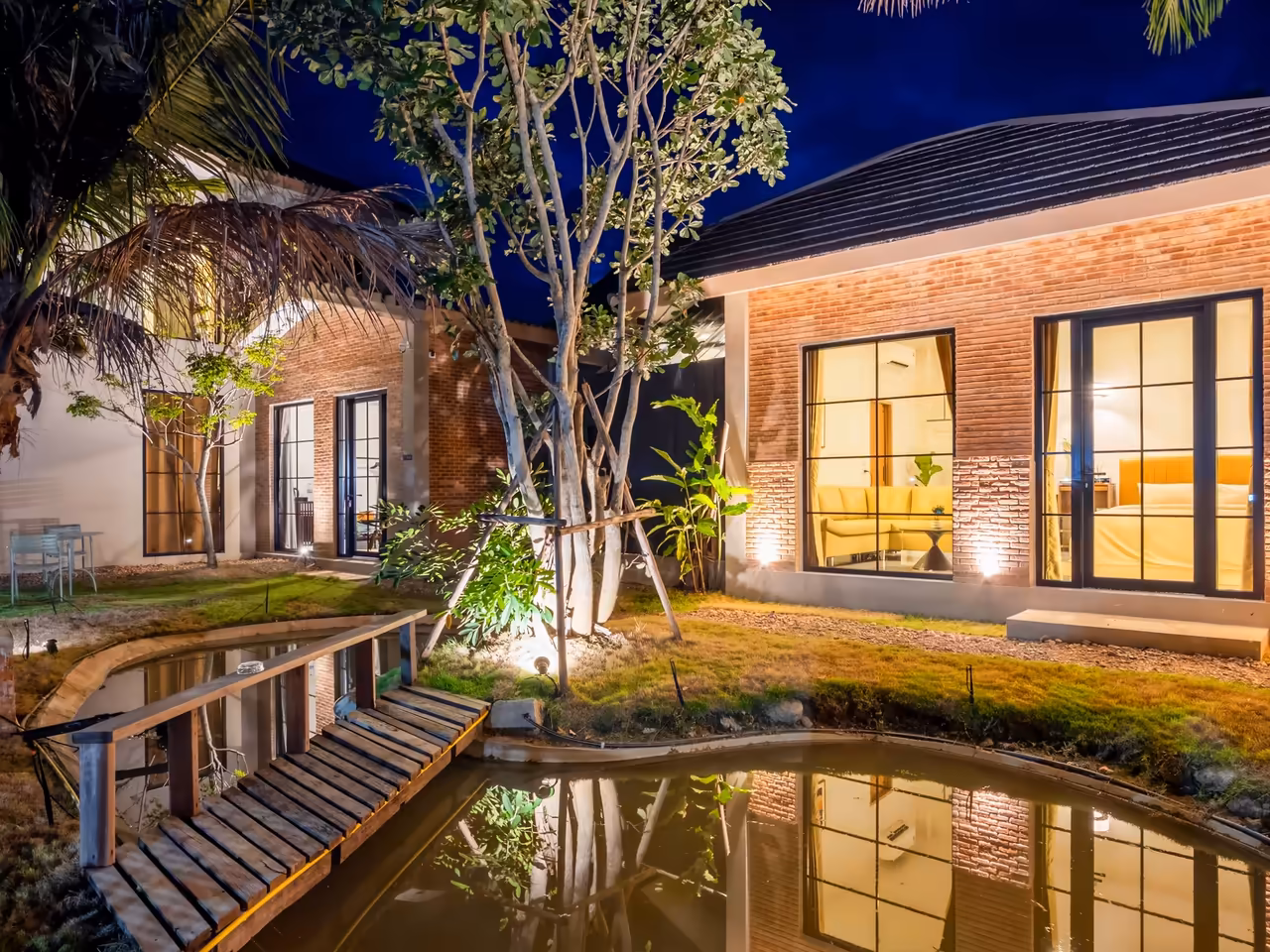 The Arch Casa design villas at twilight in Pai — one of our six owner-run stays, bookable direct